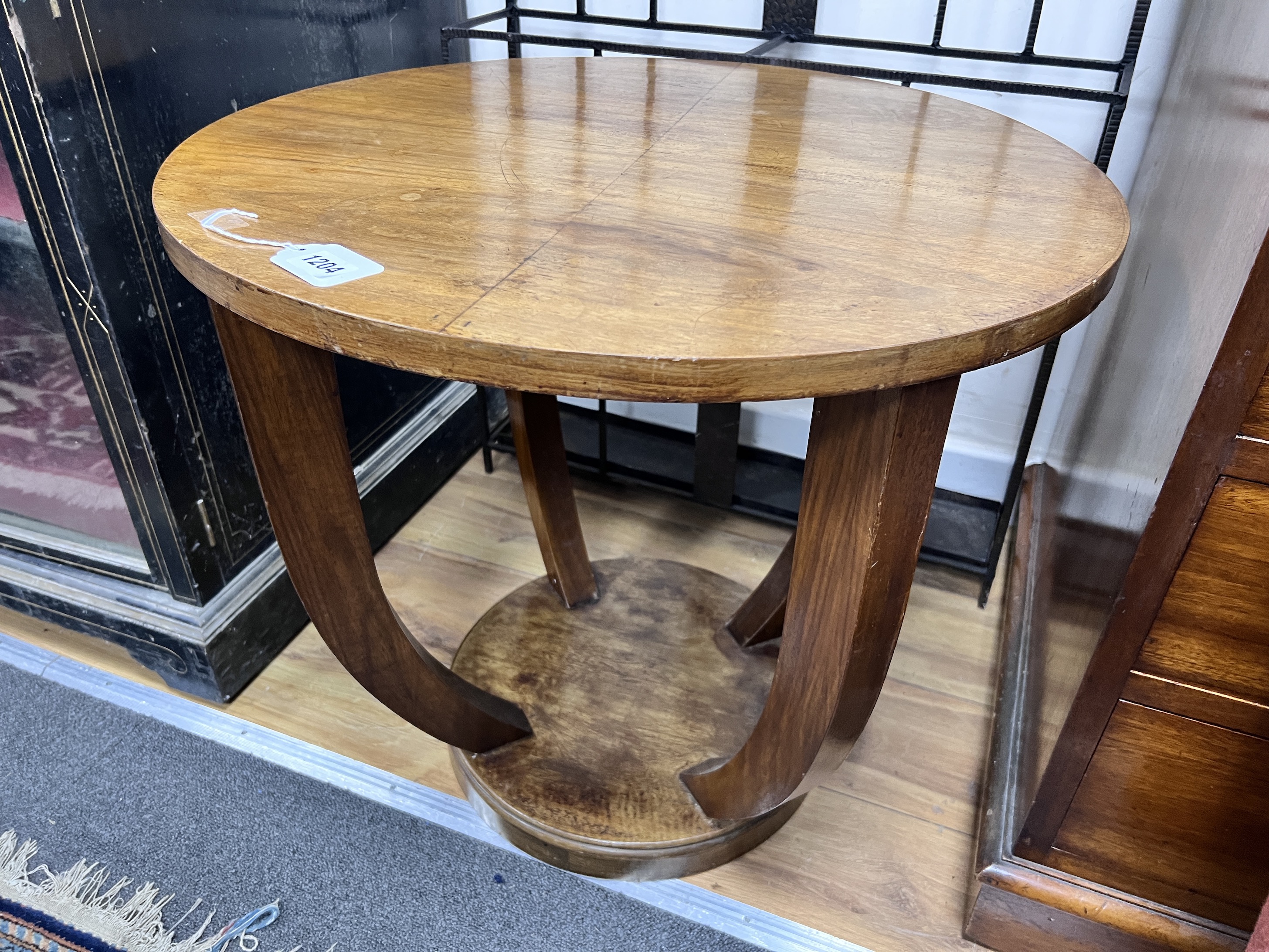 A French Art Deco walnut occasional table, diameter 59cm, height 56cm